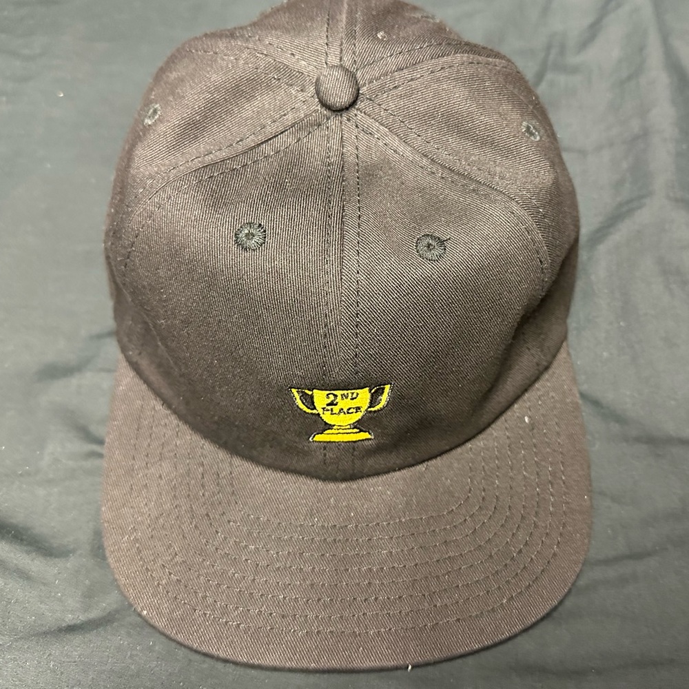 Cold world strap back hat